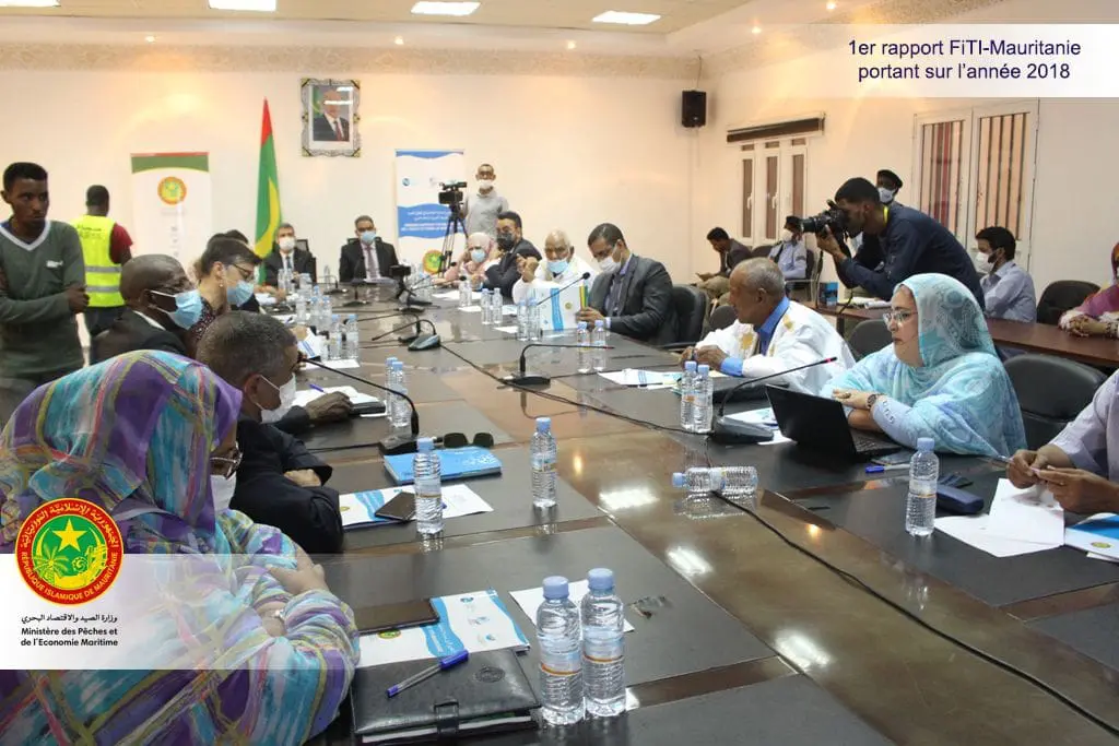Officials seated around a conference table at a fisheries transparency meeting in Mauritania